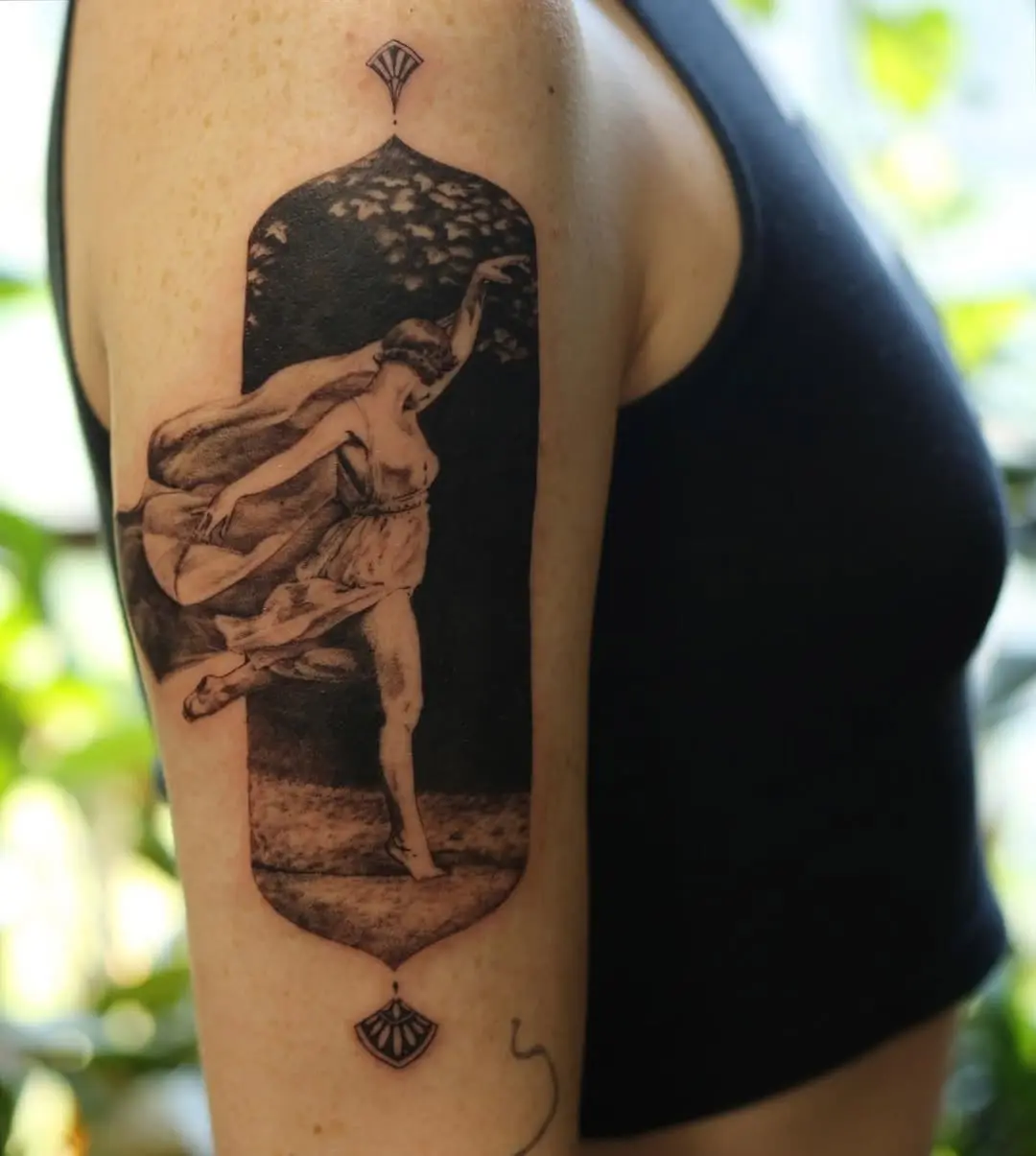 Elegant ballet dancer tattoo with floral elements