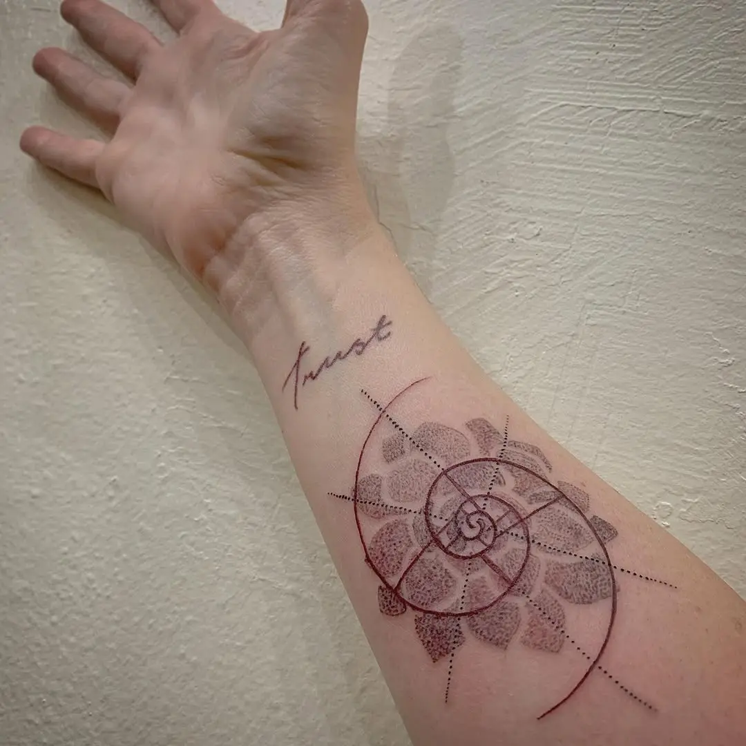 Intricate Fibonacci spiral tattoo on forearm