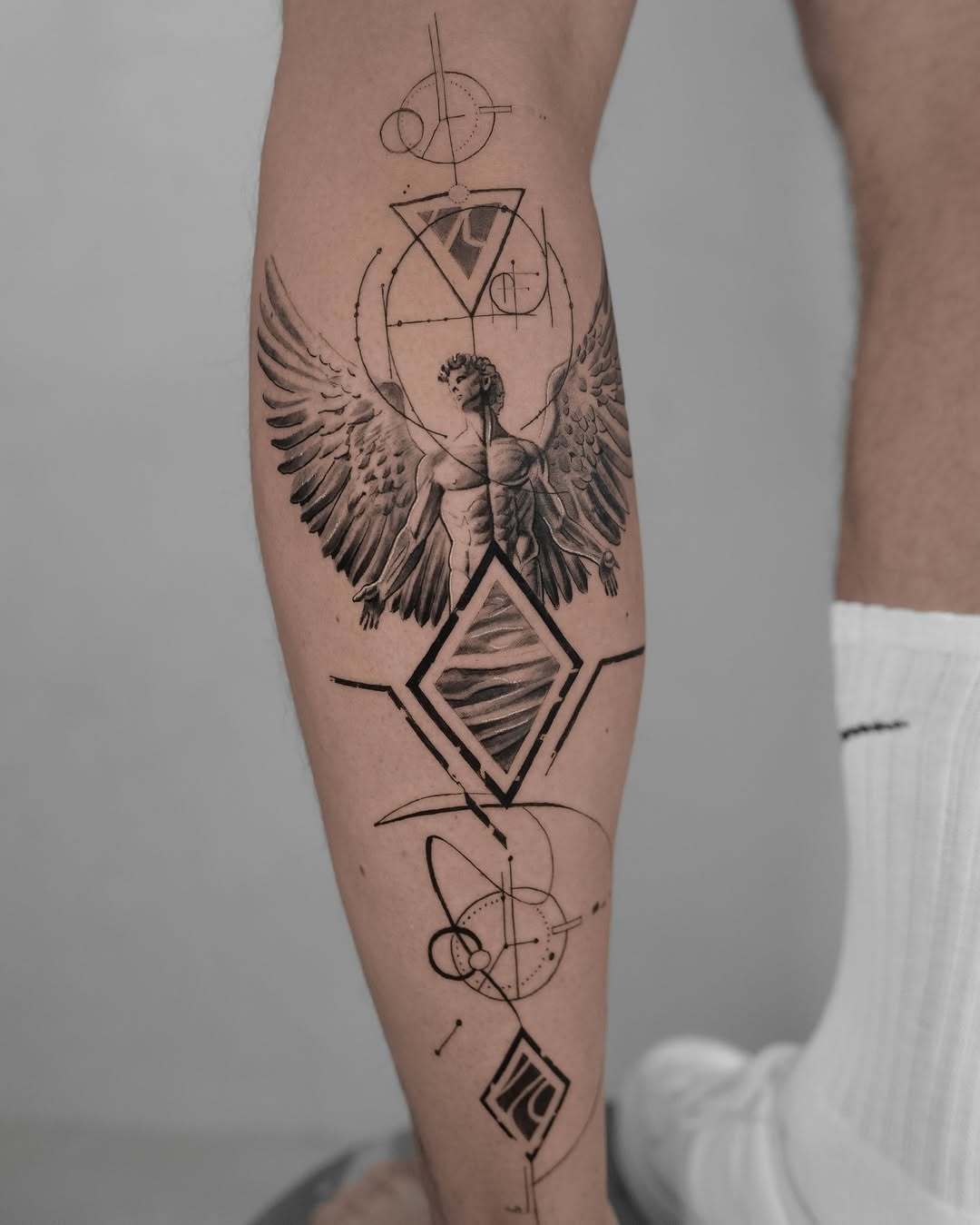 Intricate Fibonacci-inspired tattoo blending geometry and nature.
