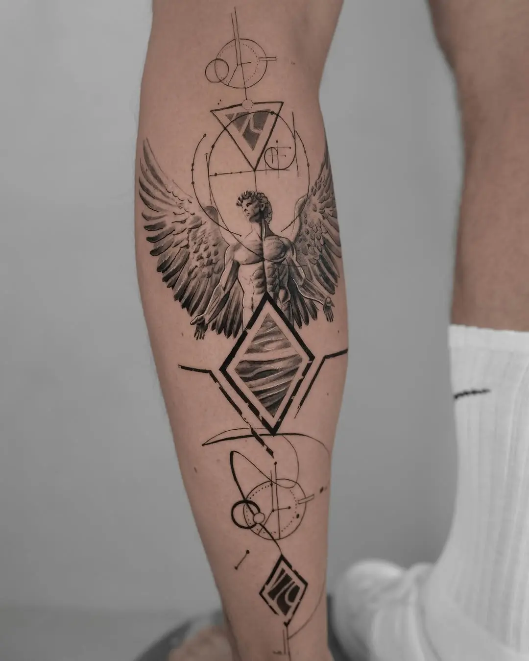 Intricate Fibonacci-inspired tattoo blending geometry and nature.