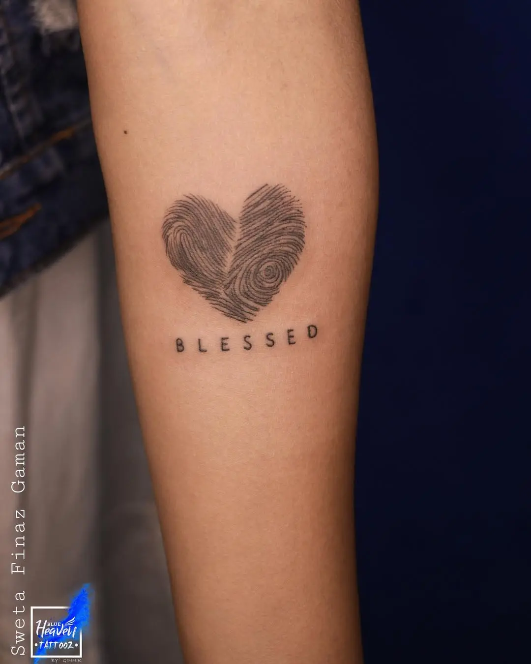 Artistic fingerprint heart tattoo with 'Blessed'