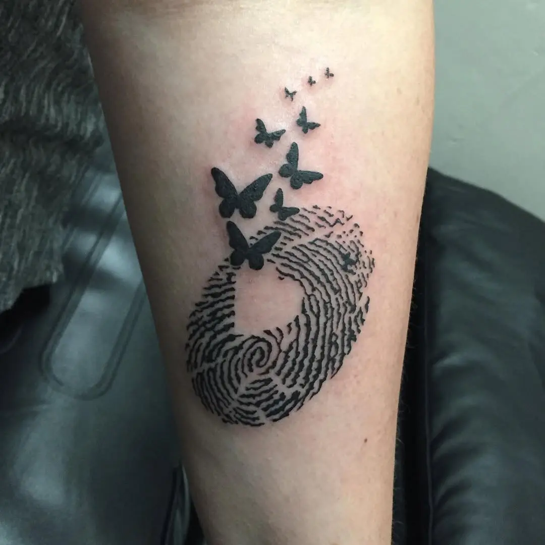Elegant fingerprint tattoo with butterfly details