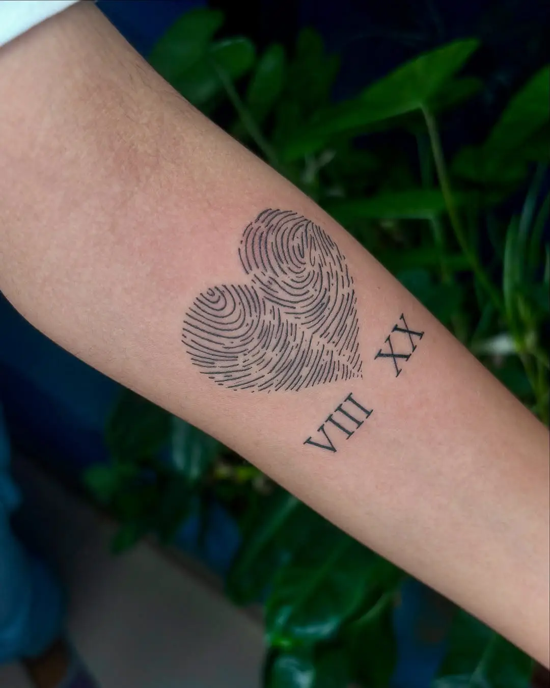 A heartfelt fingerprint tattoo with personal touch