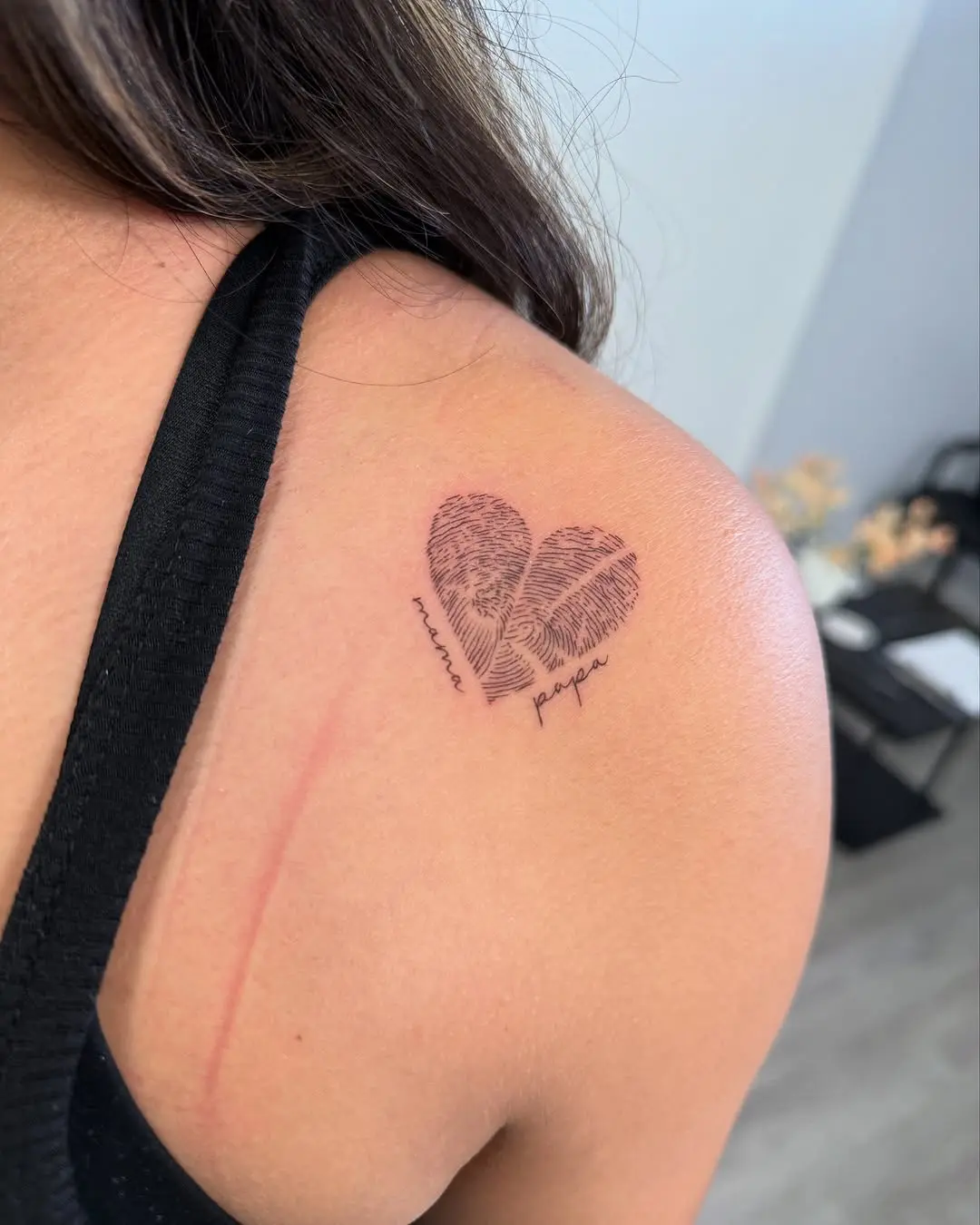 A unique fingerprint heart tattoo for connection