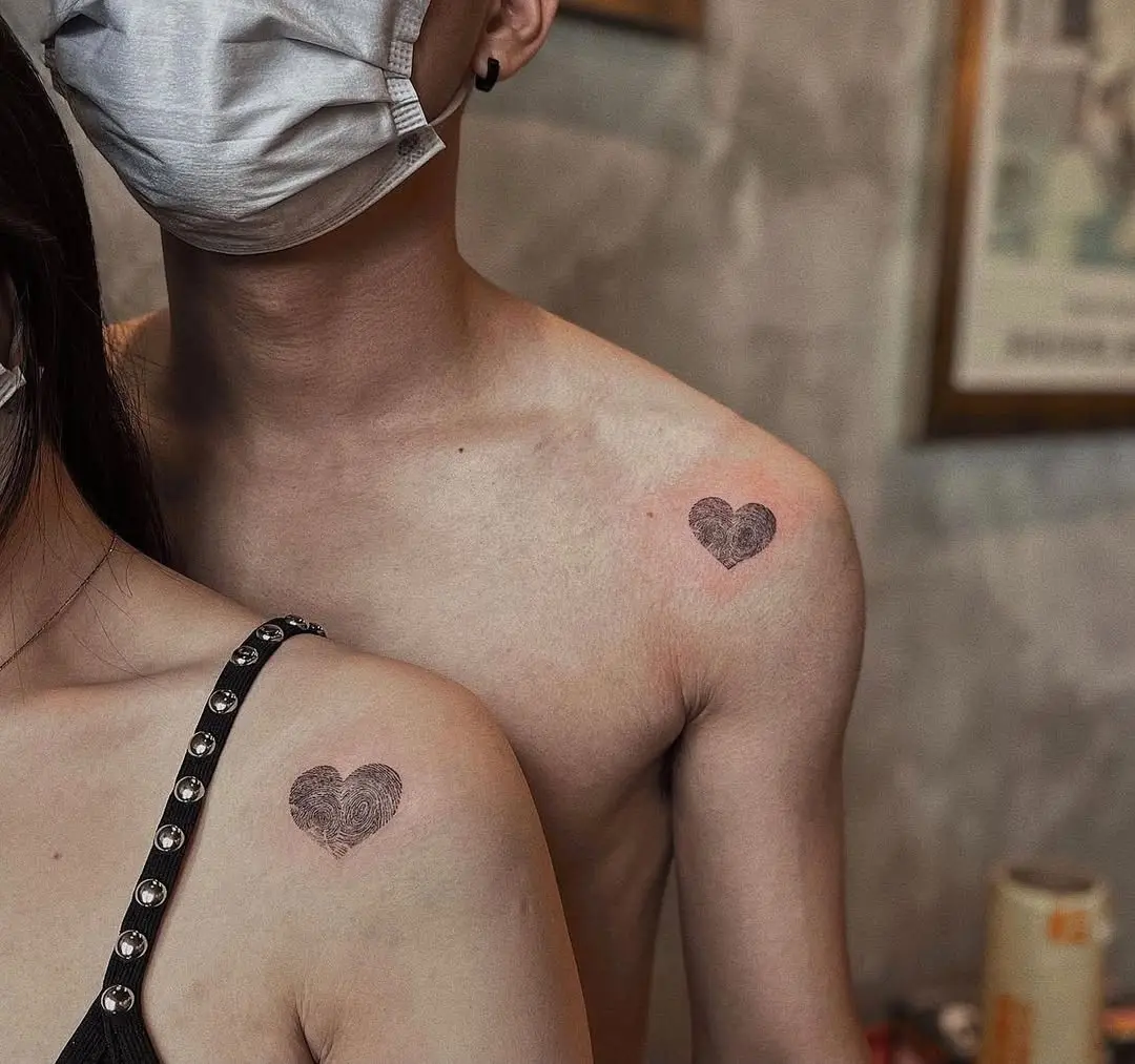 Stylish fingerprint heart tattoos on display