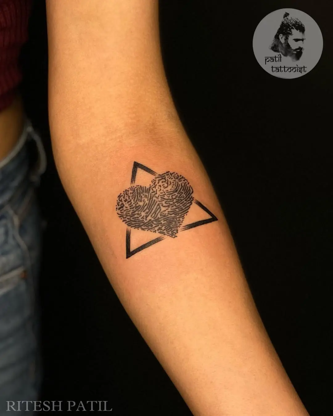 Artistic fingerprint heart within geometric shapes