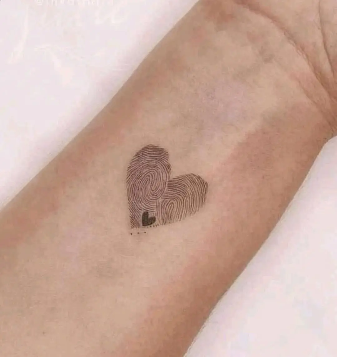 Unique heart-shaped fingerprint tattoo design