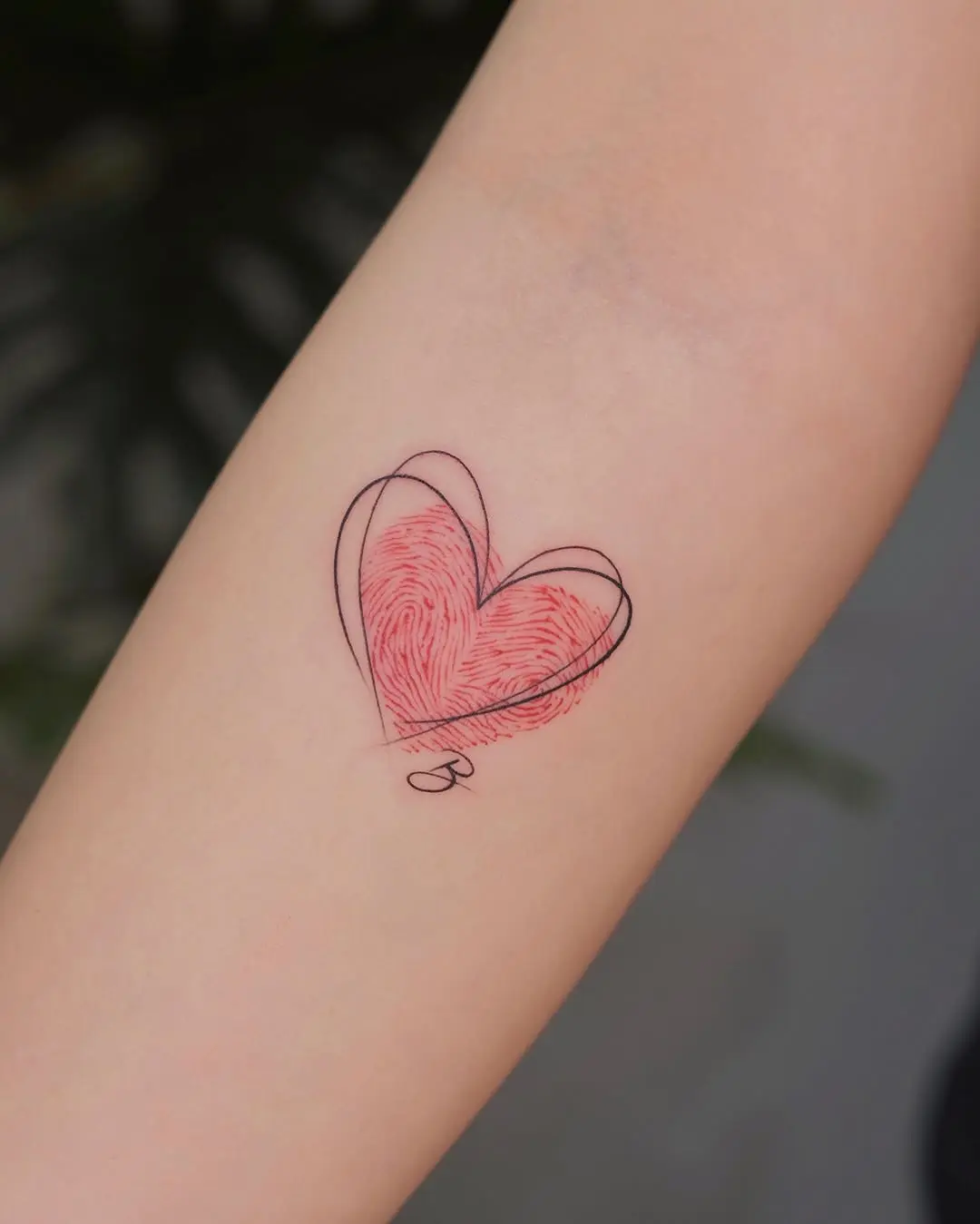 Unique Heart-Shaped Fingerprint Tattoo Design