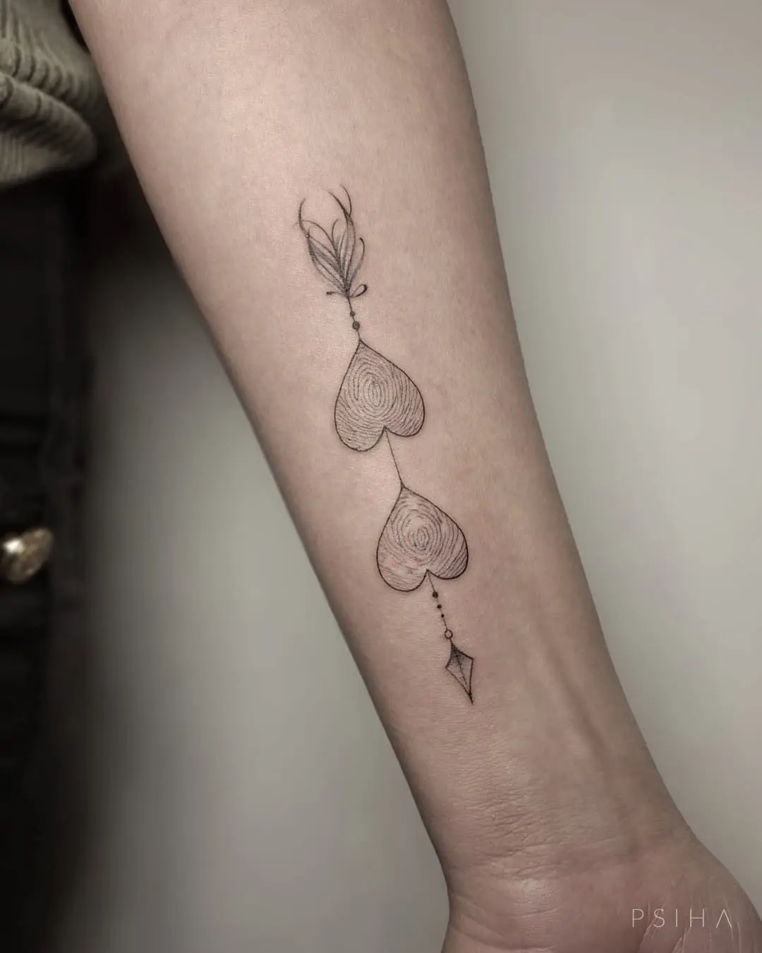 Intricate fingerprint heart tattoo design details