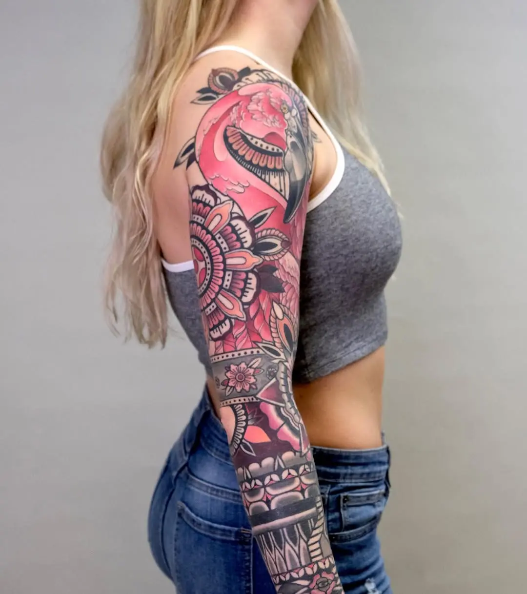 Vibrant flamingo full sleeve tattoo art