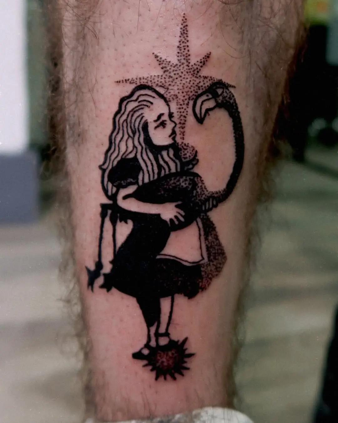 Artistic flamingo tattoo featuring a whimsical girl