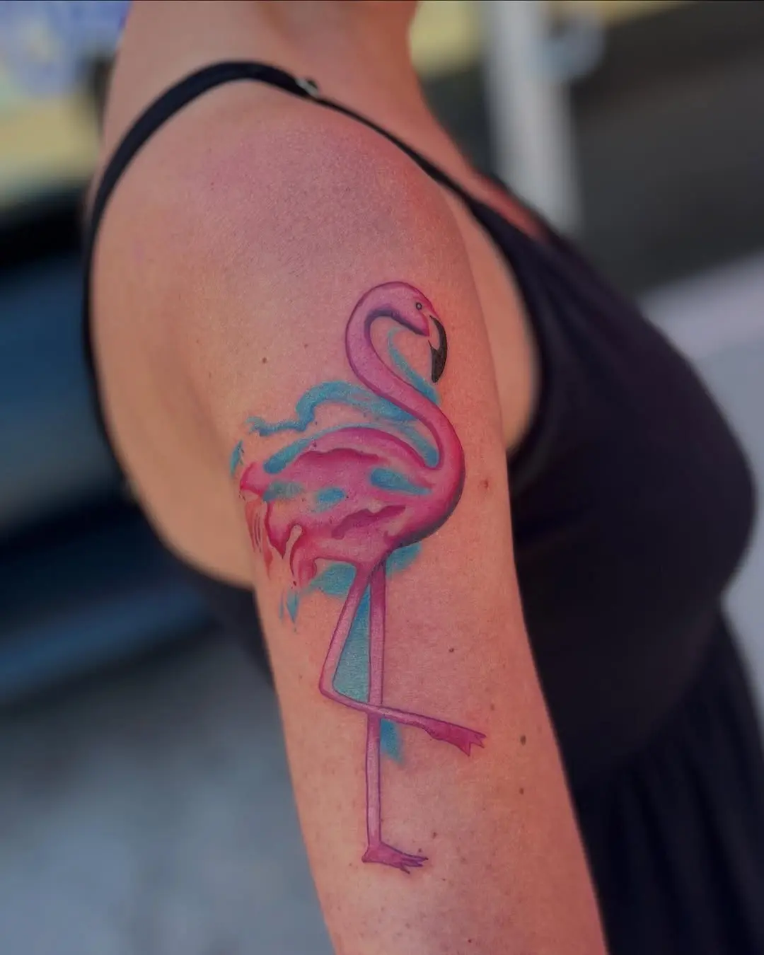 Colorful flamingo tattoo exudes vibrant charm