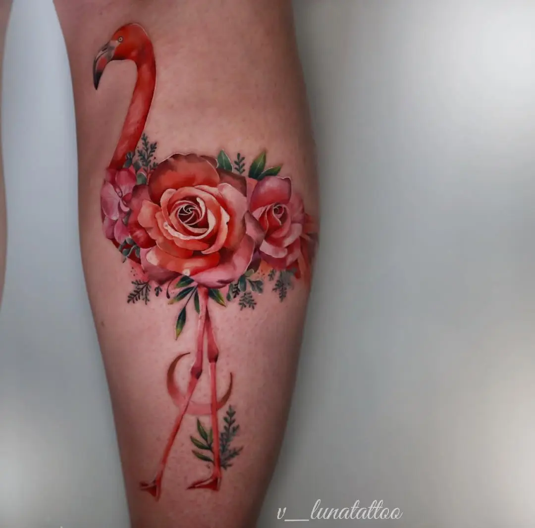 Flamingo tattoo adorned with vibrant roses