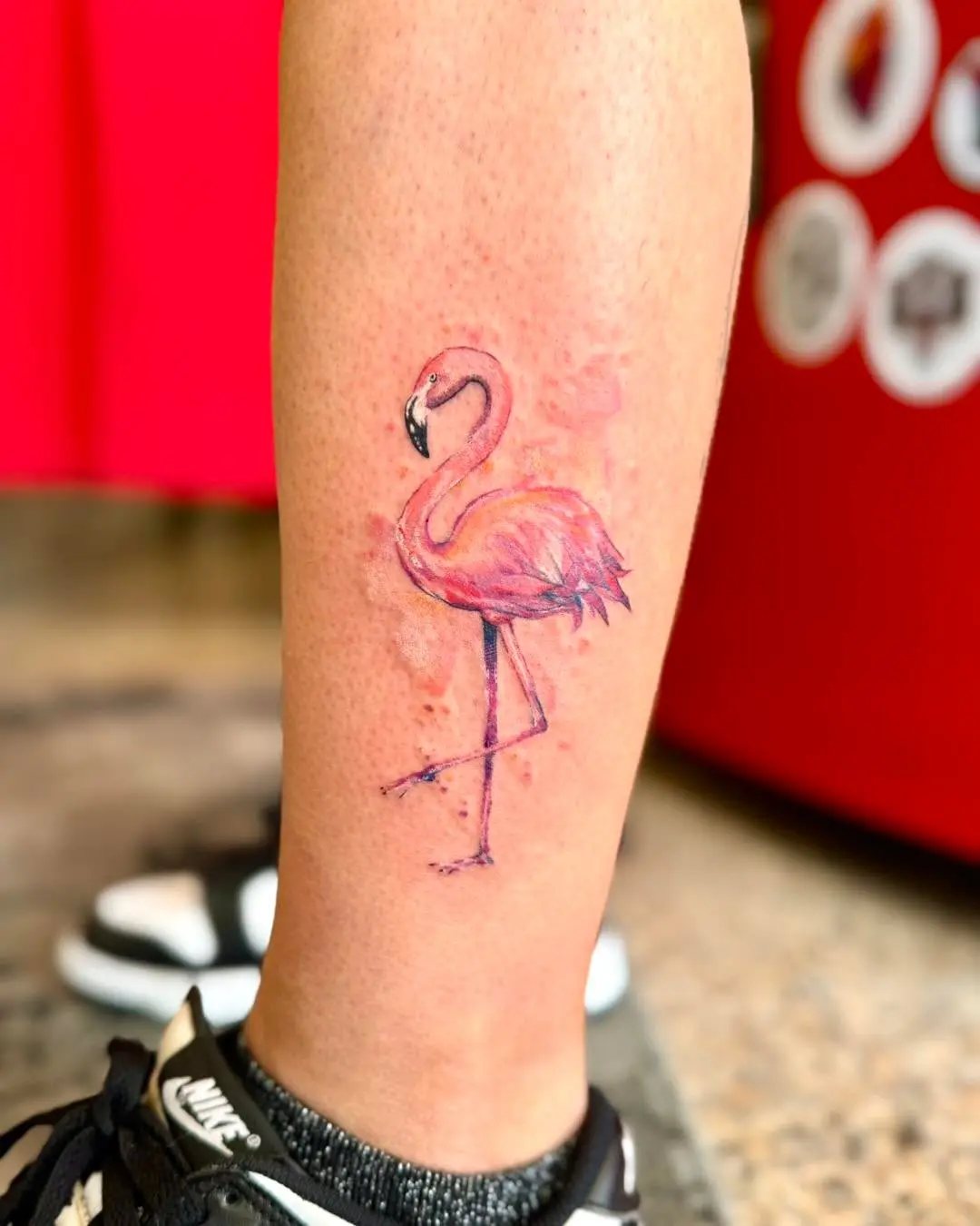 Vibrant flamingo tattoo on a calf tattoo