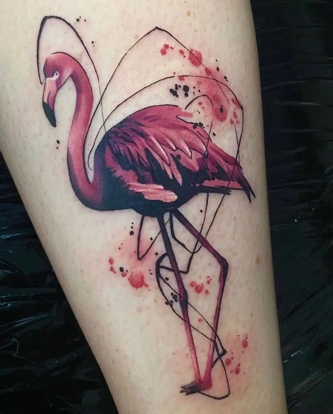 Colorful flamingo tattoo with abstract detailing