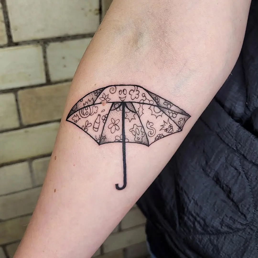 Elegant floral umbrella tattoo for charm