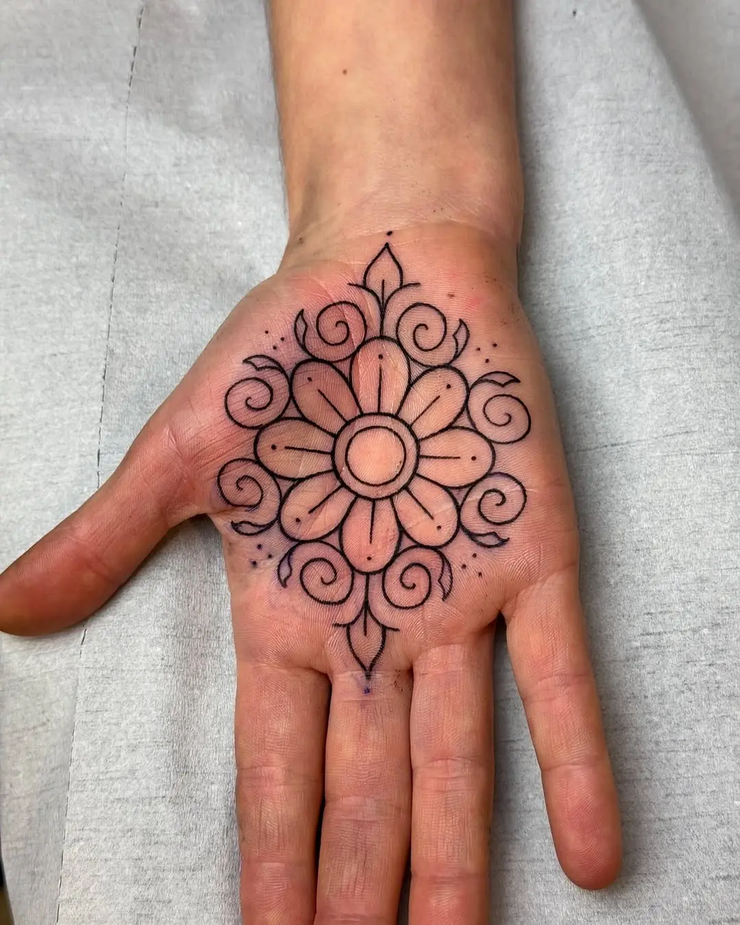 Intricate floral palm tattoo design for body art