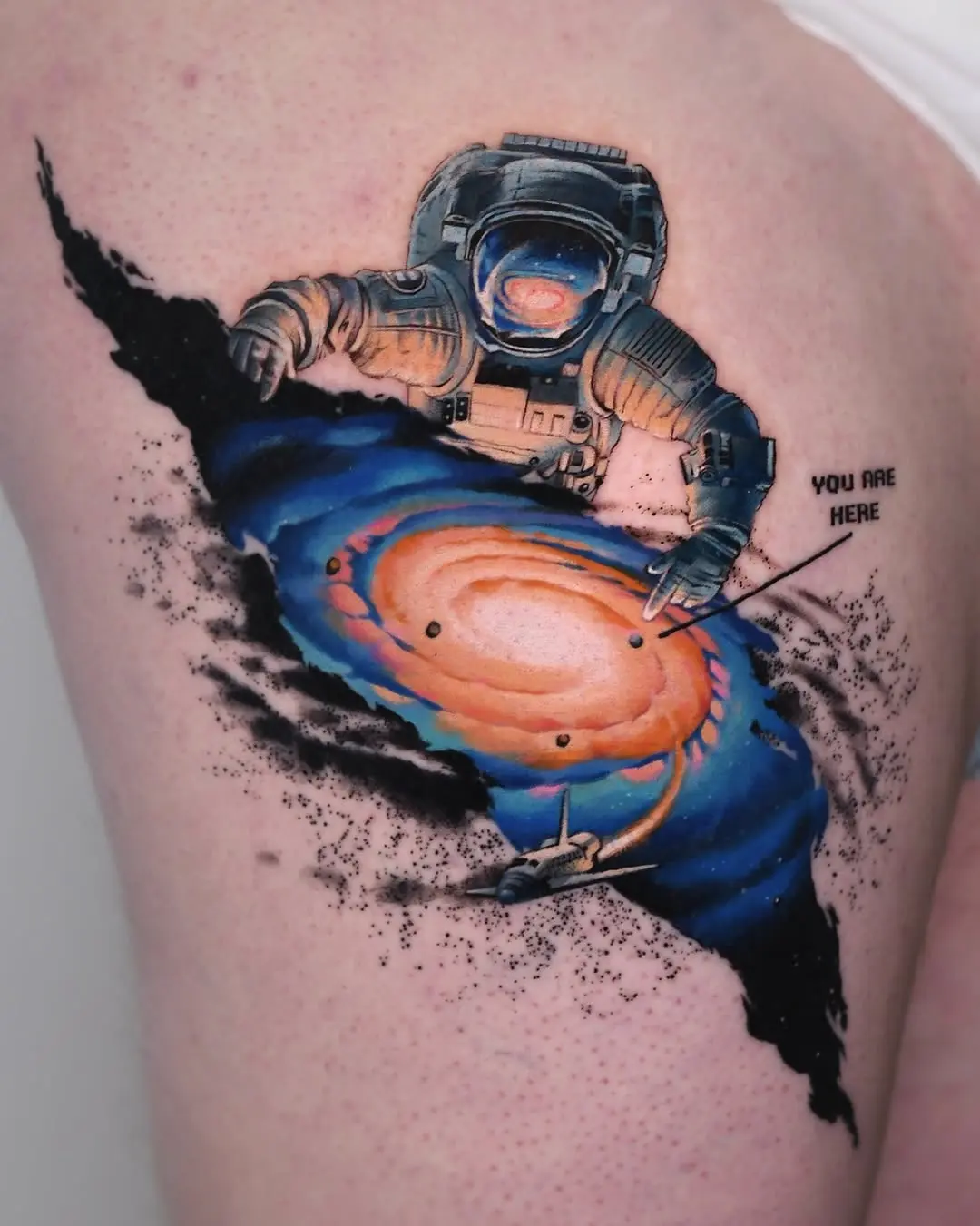 Cosmic astronaut tattoo exploring the universe