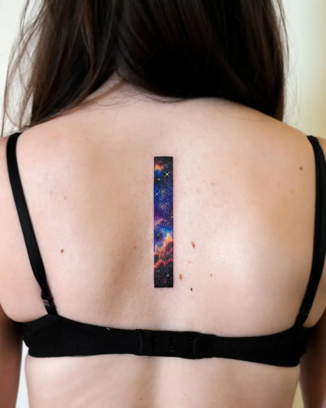 Unique Vertical Galaxy Tattoo Design on Back
