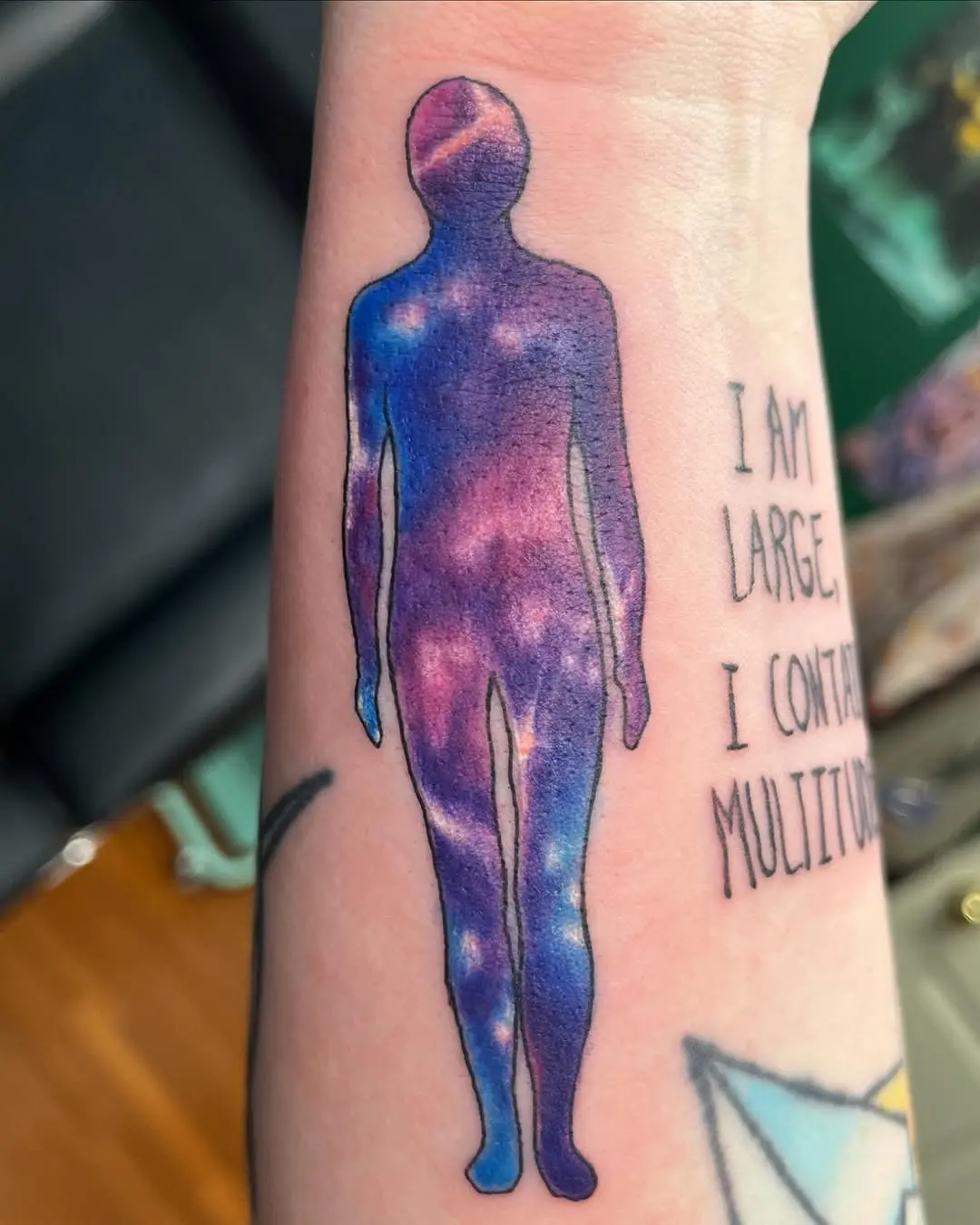 Cosmic silhouette tattoo with inspirational quote
