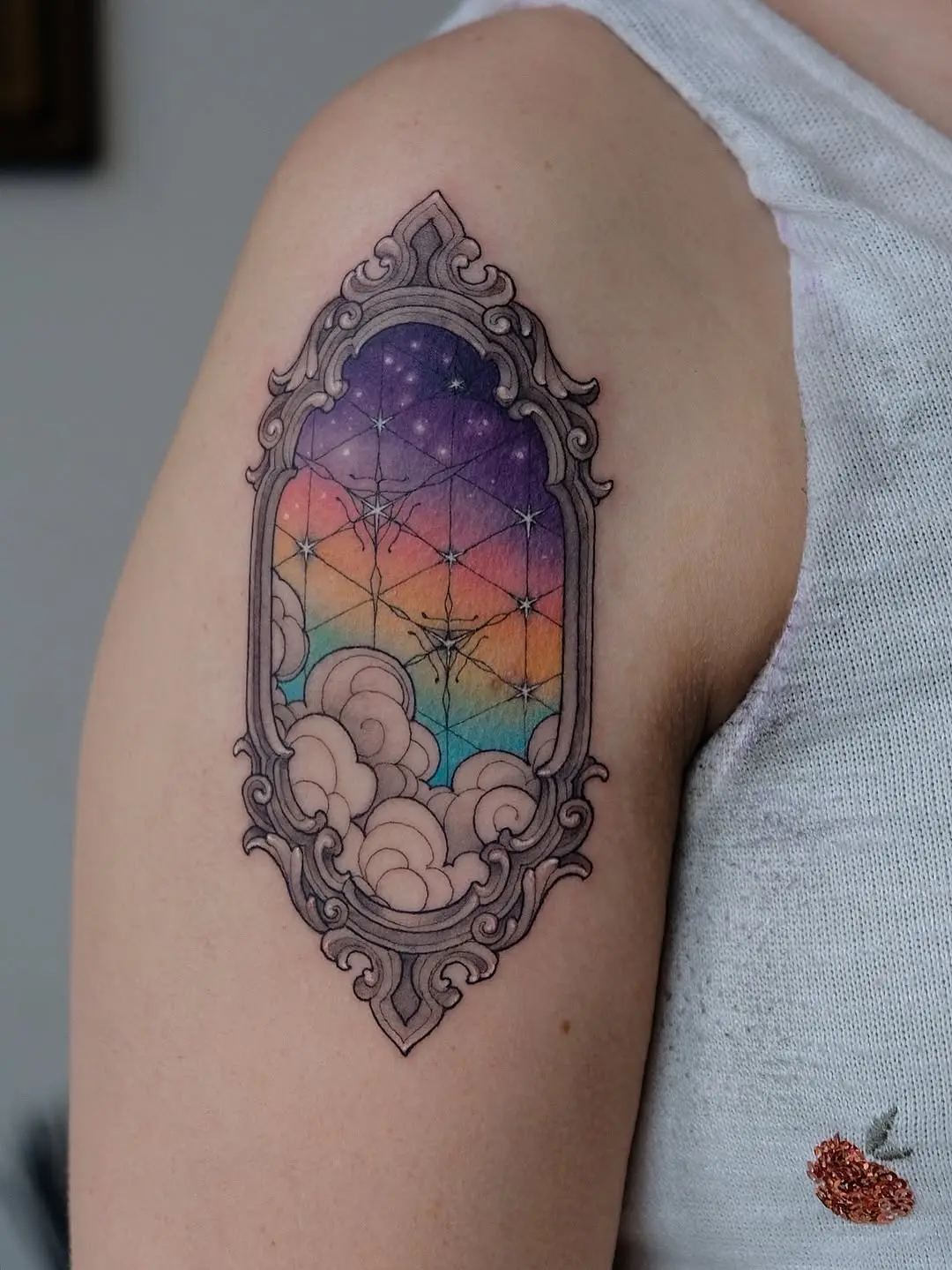 Colorful, ornate galaxy tattoo in a frame