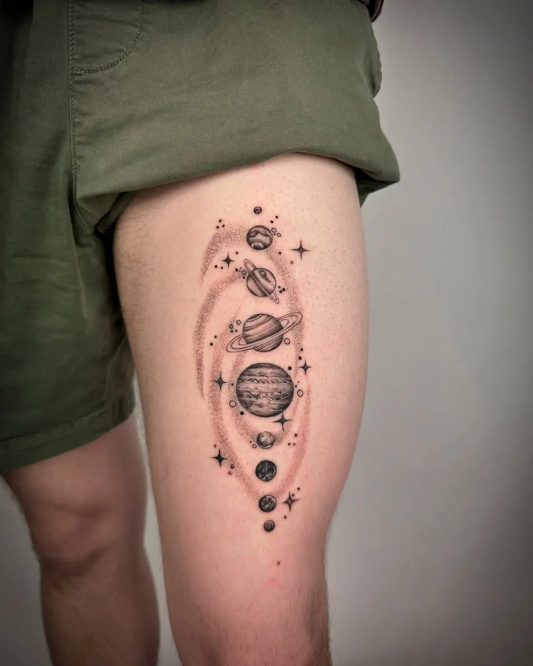 Stunning Space-Themed Tattoo on Thigh