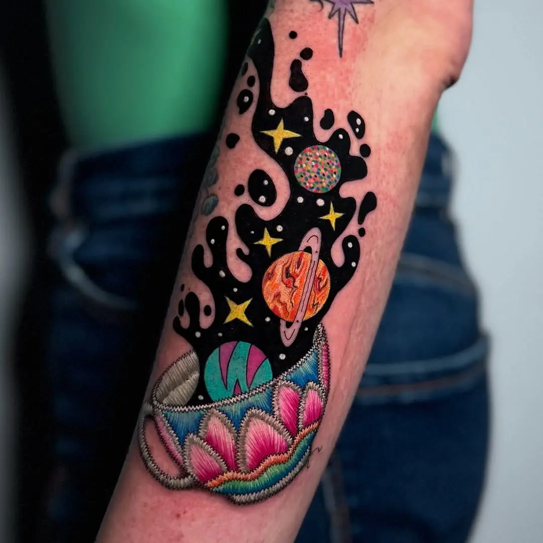 Vibrant galaxy tattoo with floral elements