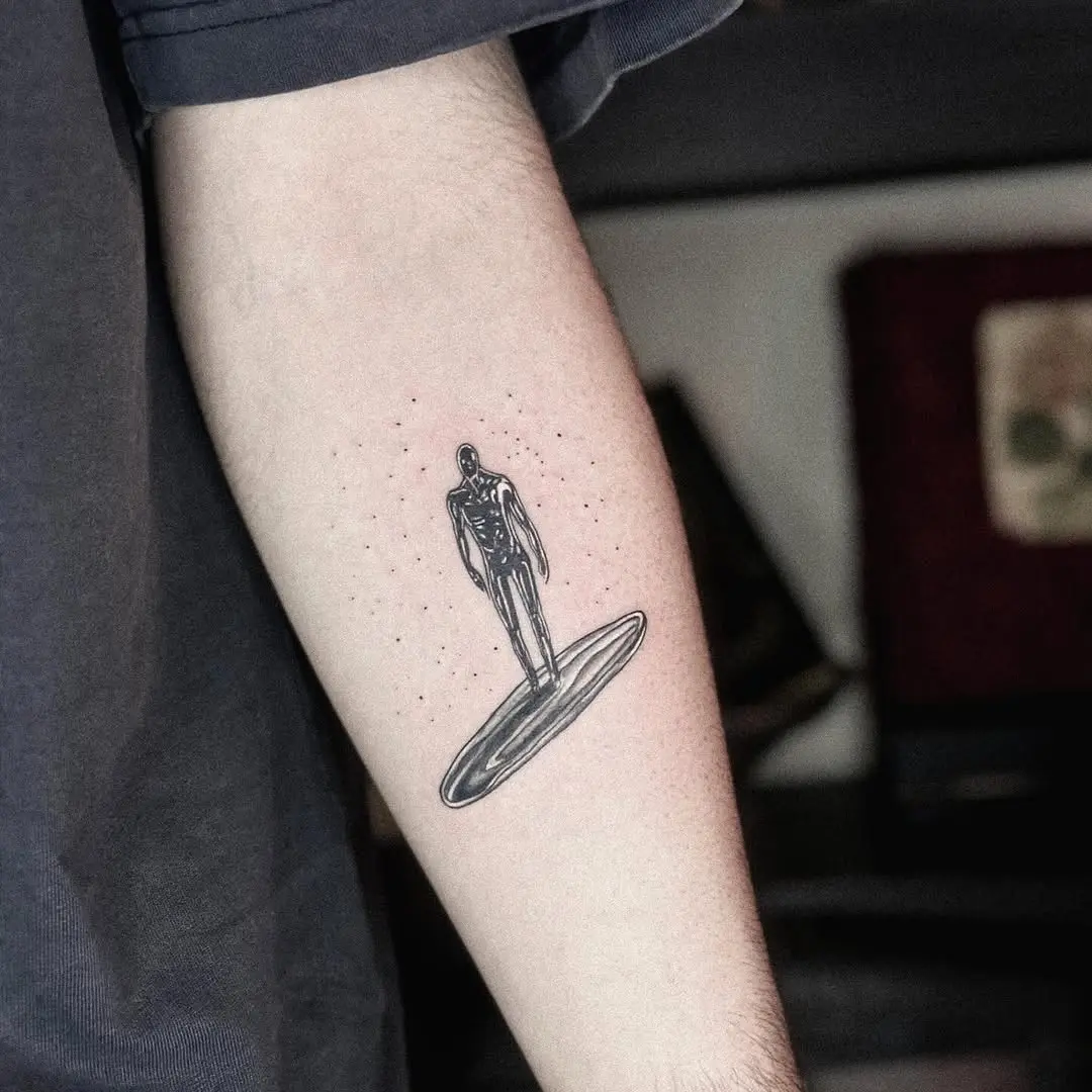 Mystical figure on a cosmic surfboard tattoo