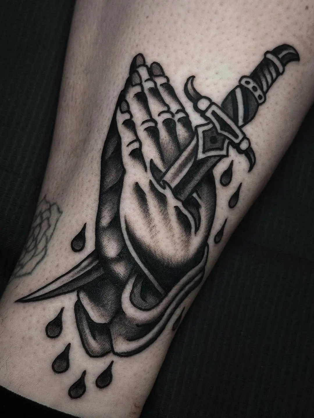 Bold Hands Holding a Dagger Tattoo