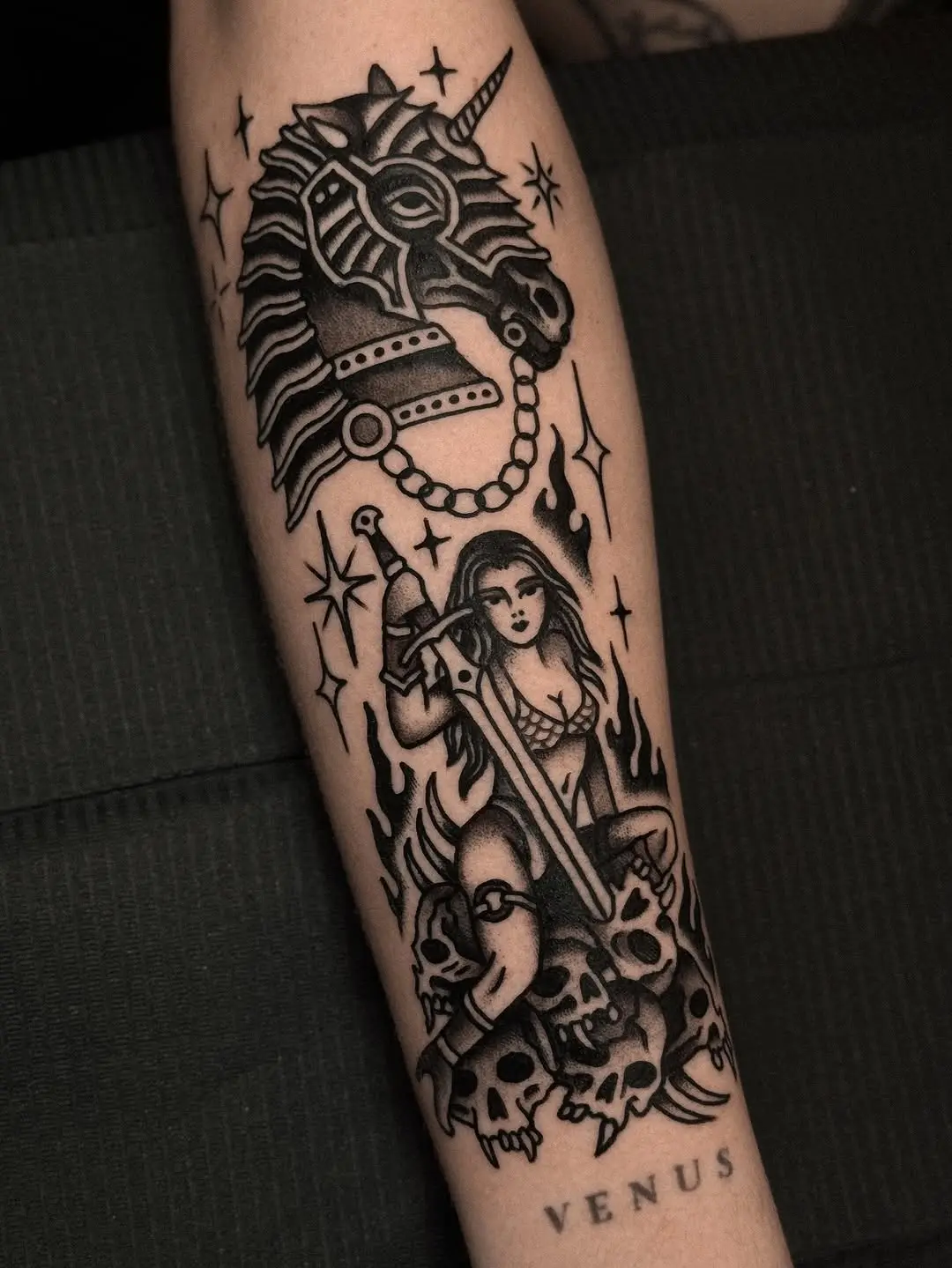 Bold fantasy-themed tattoo with a unicorn