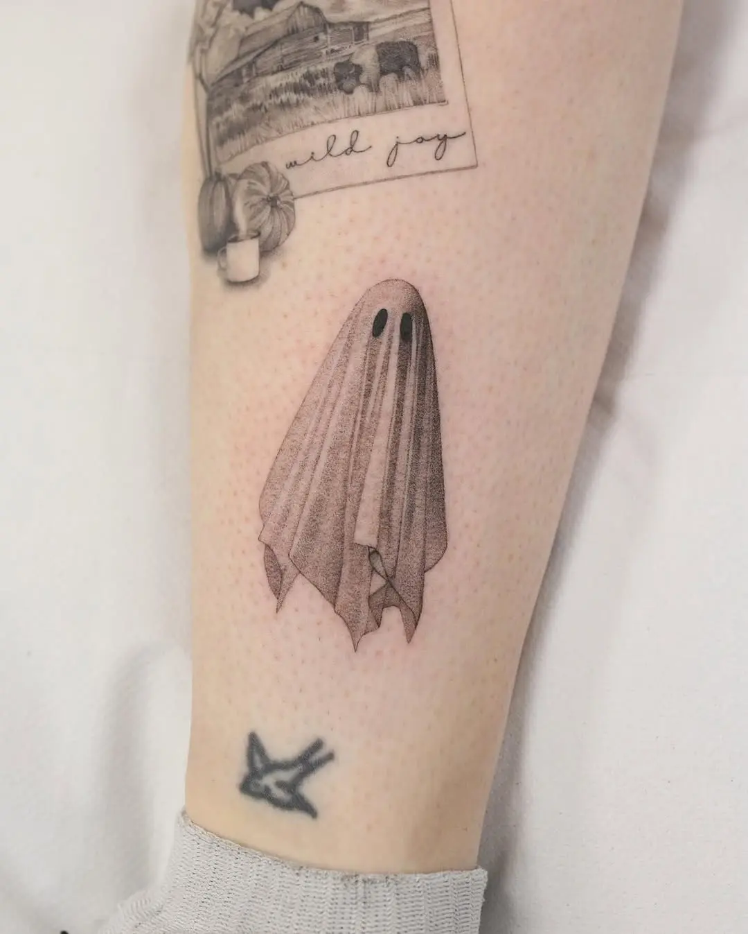 Charming ghost tattoo for a playful vibe