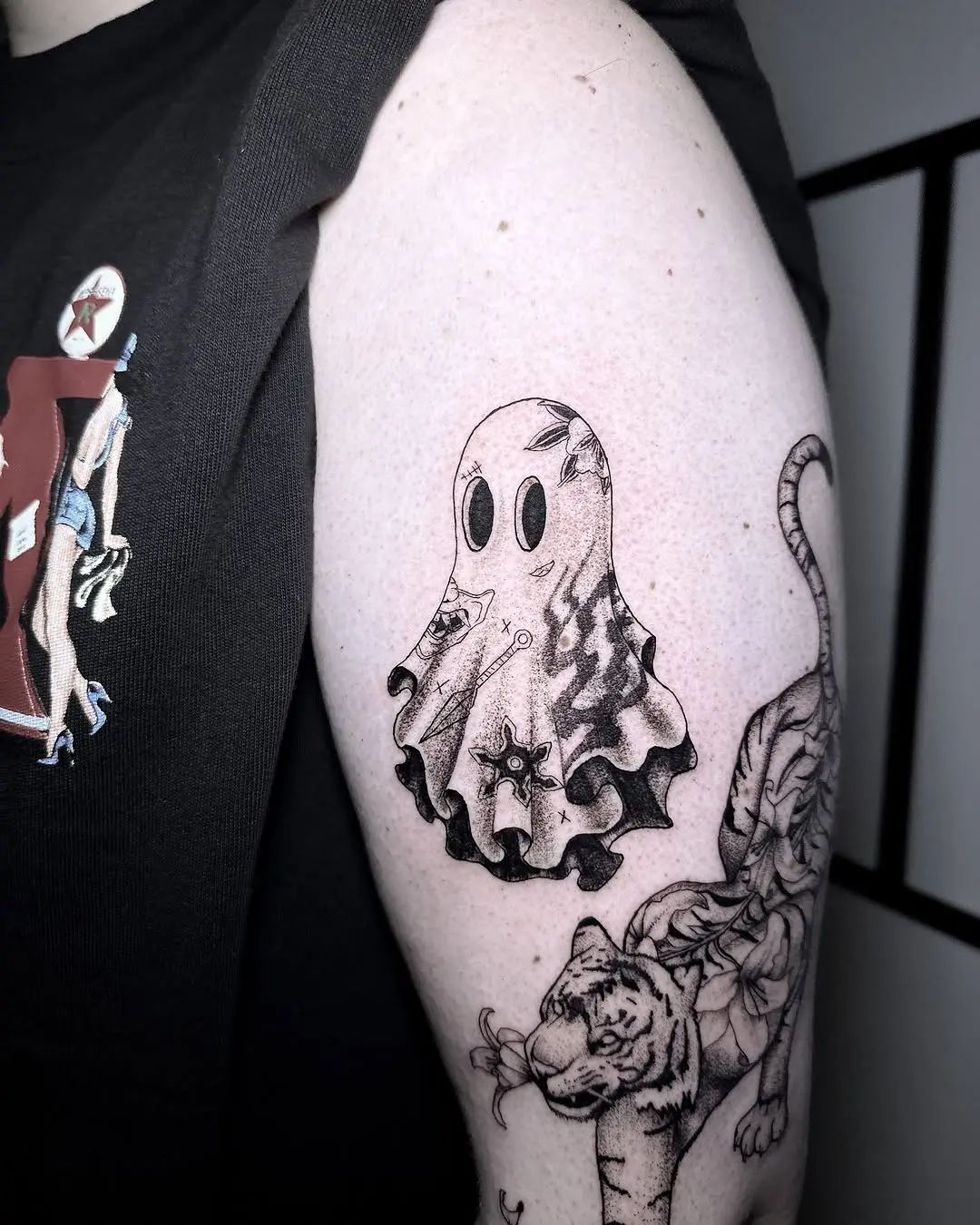 Charming ghost tattoo with playful vibes