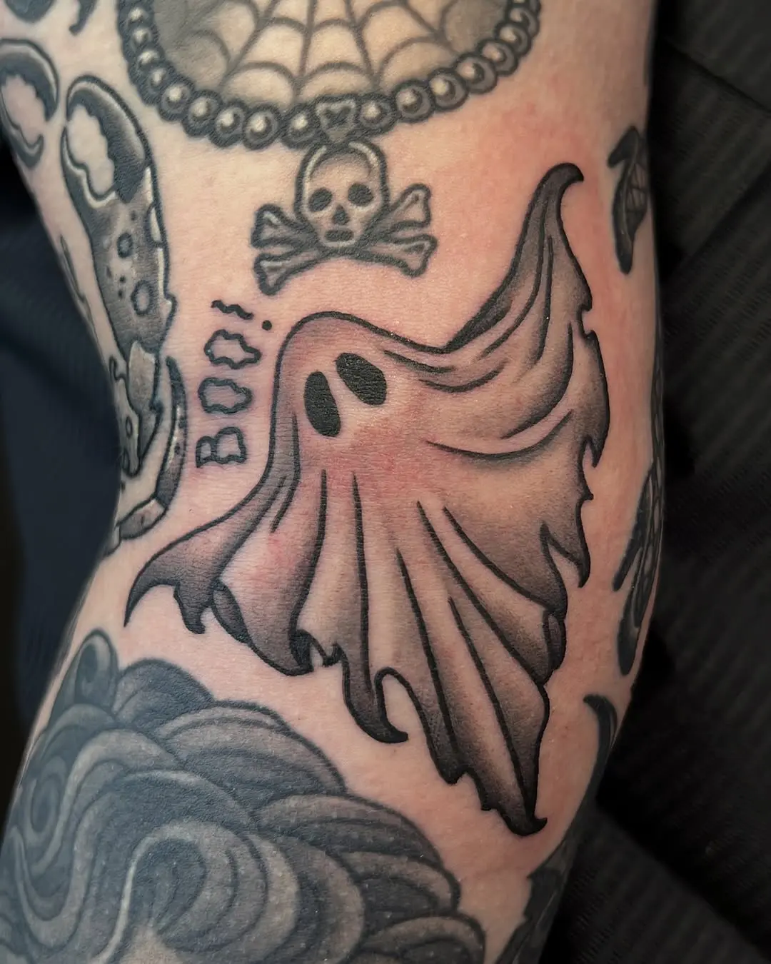 Classic ghost tattoo with playful vibe