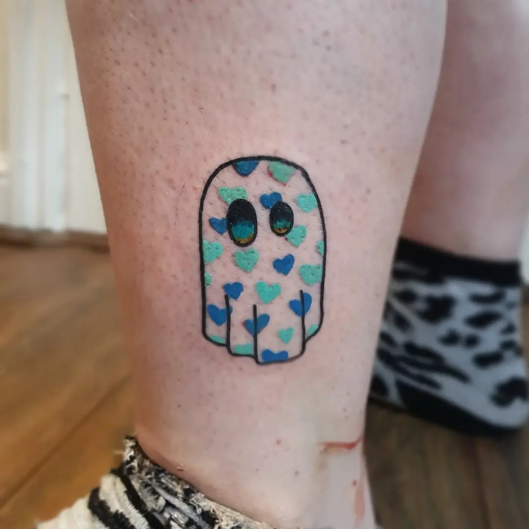 Adorable ghost tattoo with heart accents