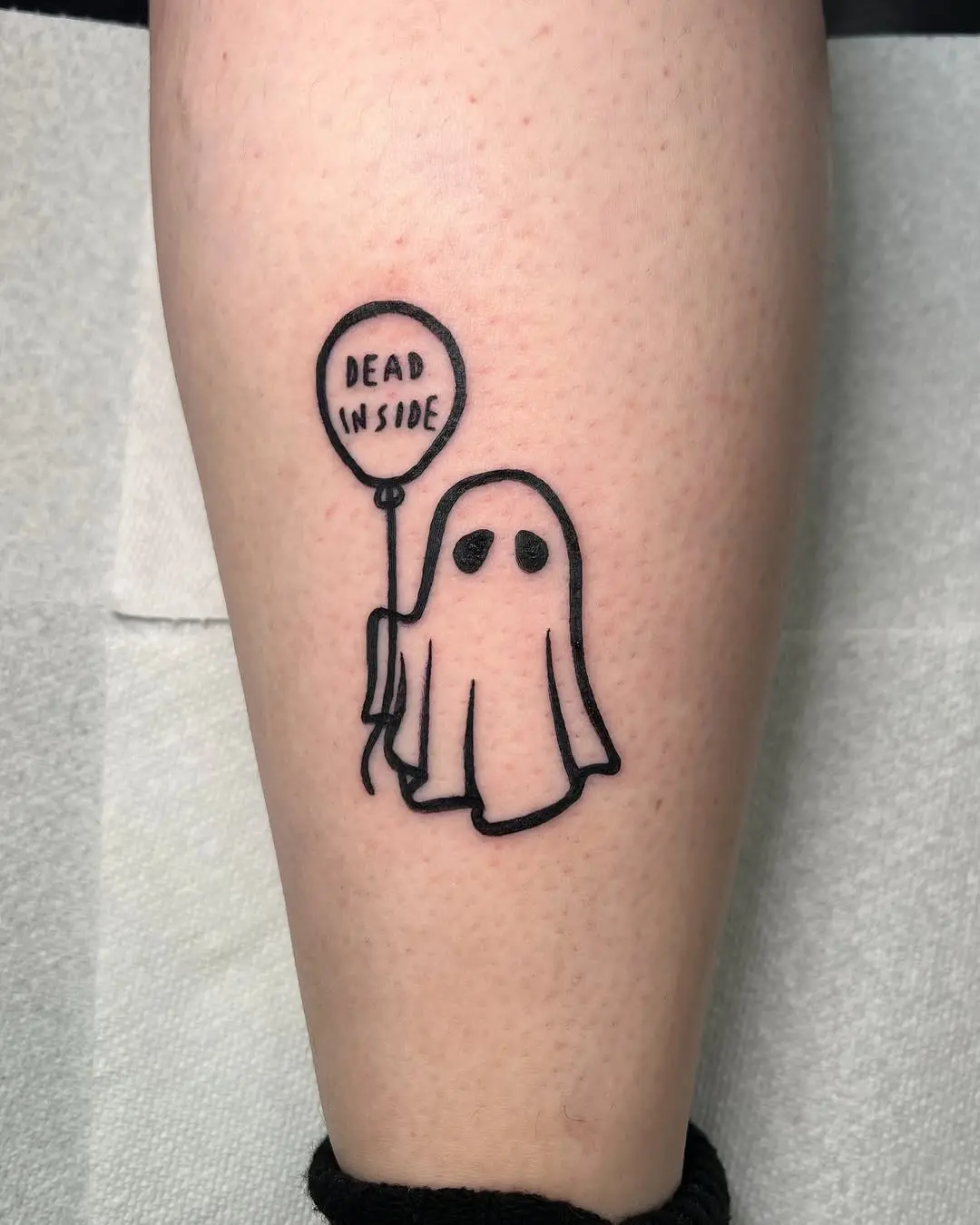 Cute ghost holding a balloon tattoo design