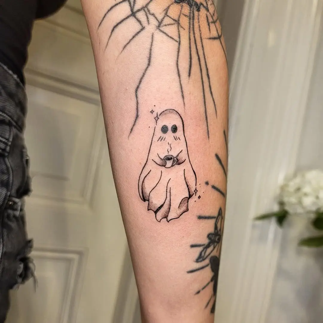 Whimsical Ghost Tattoo with Sparkles and Charm