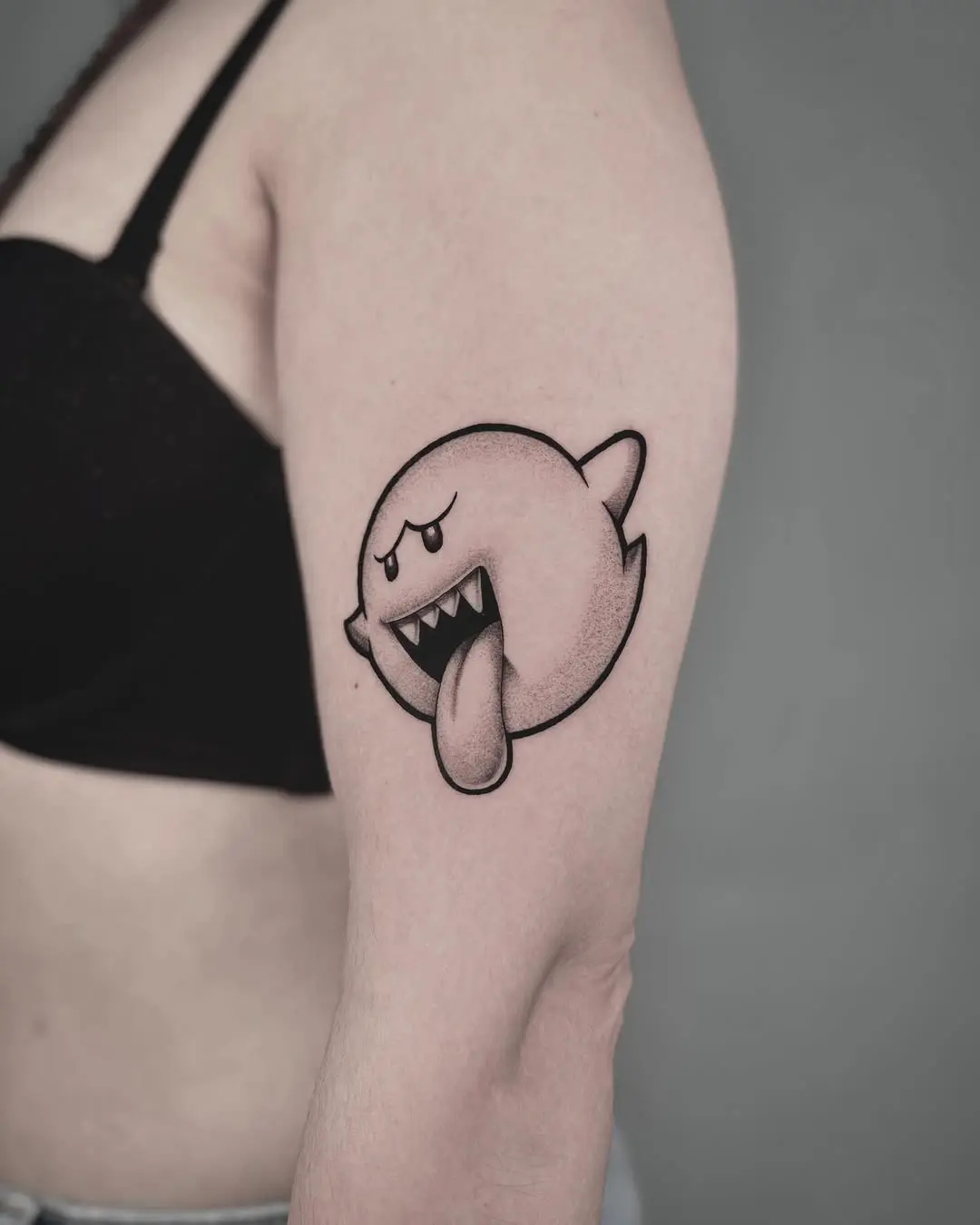 Playful ghost tattoo bursting with personality