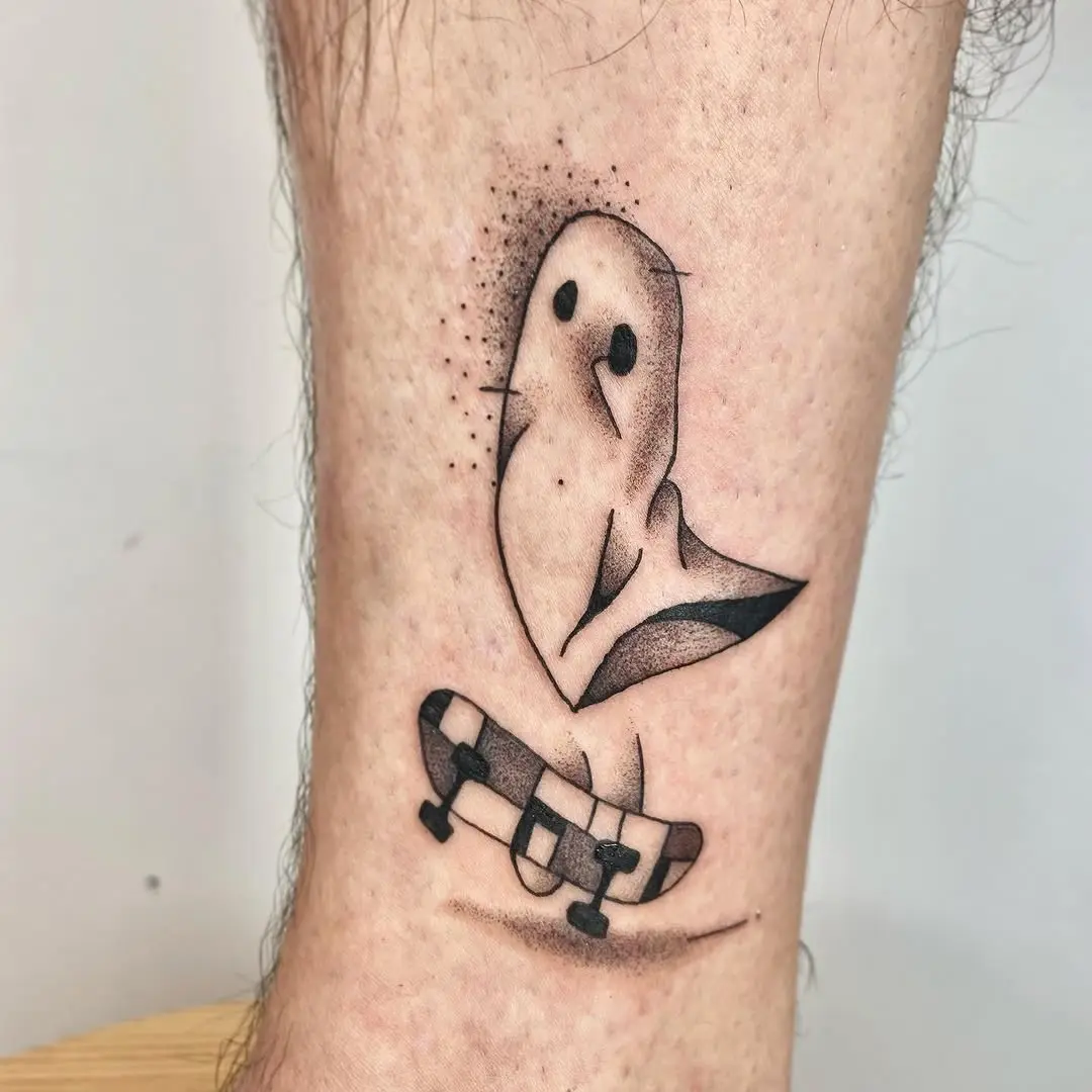 Playful ghost tattoo on a skateboard design