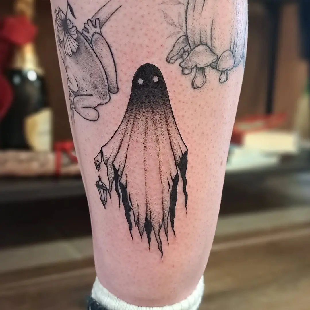 Whimsical ghost tattoo with haunting details