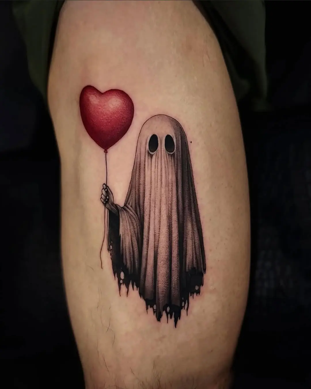 Whimsical ghost holding a heart-shaped balloon