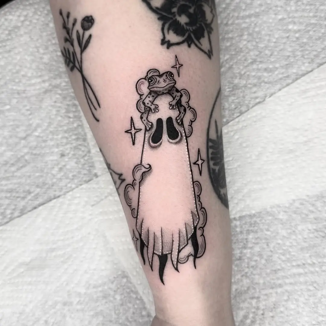 Charming ghost tattoo with floral elements