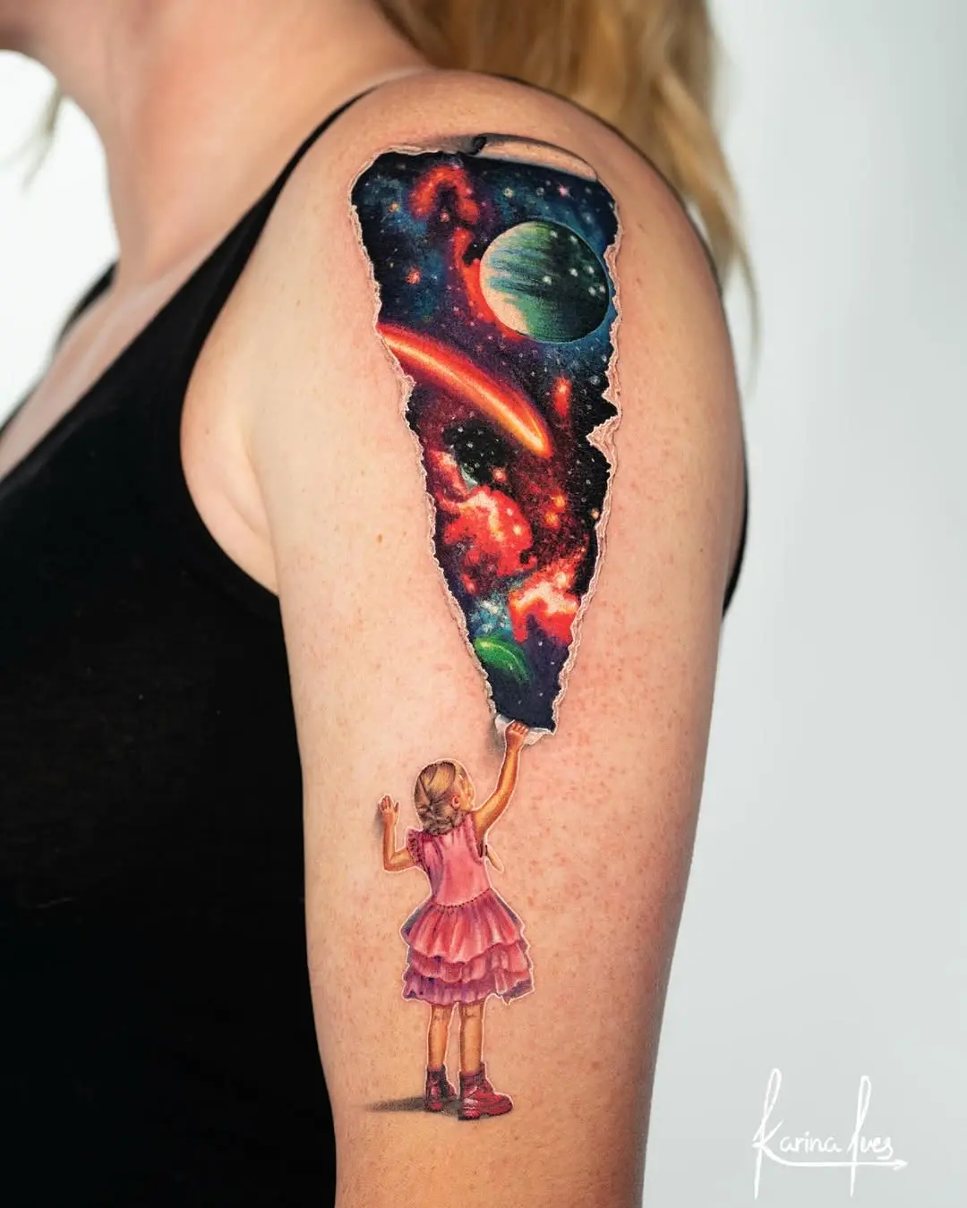 Girl with Bright Galaxy Tattoo on Arm