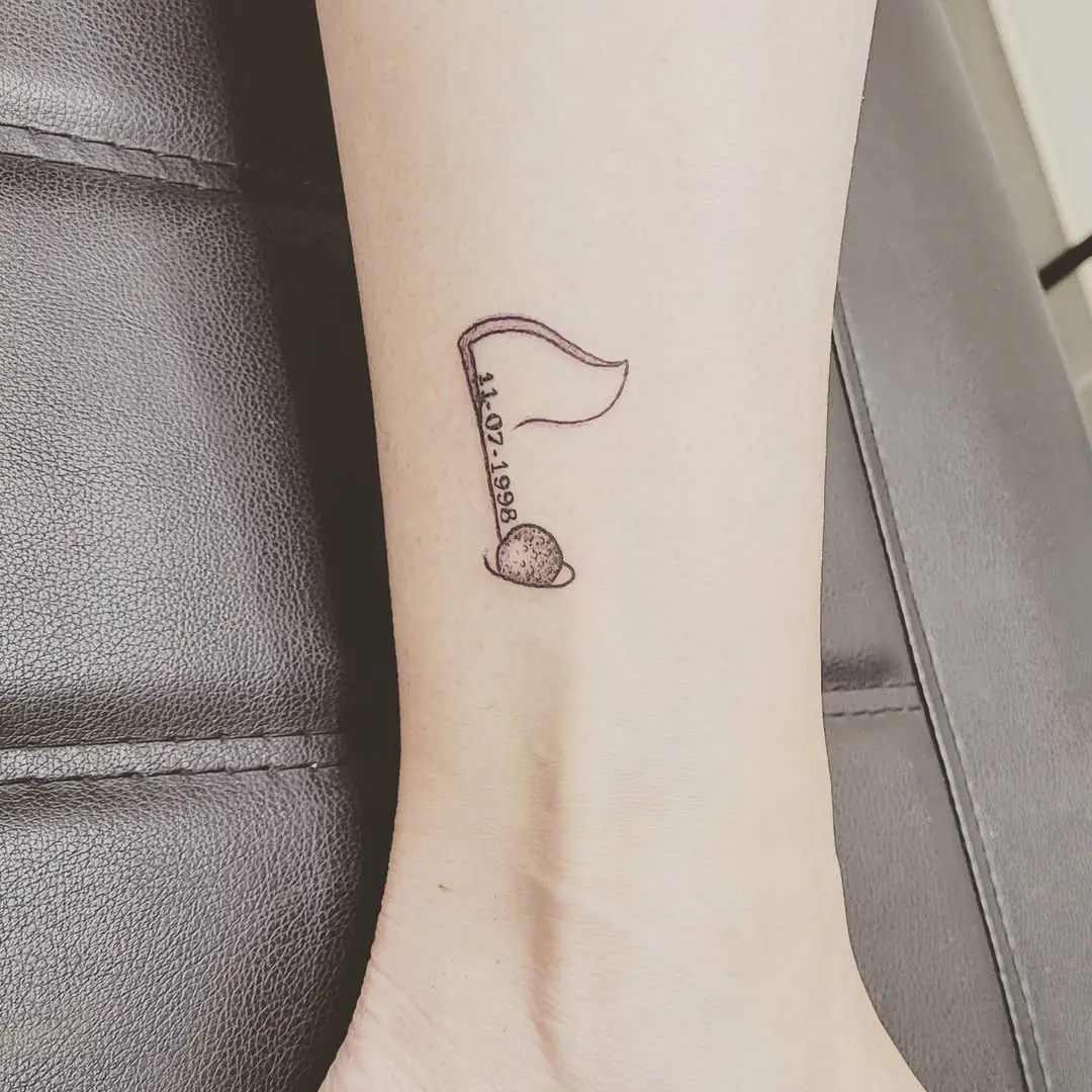 Unique golf flag and ball tattoo design