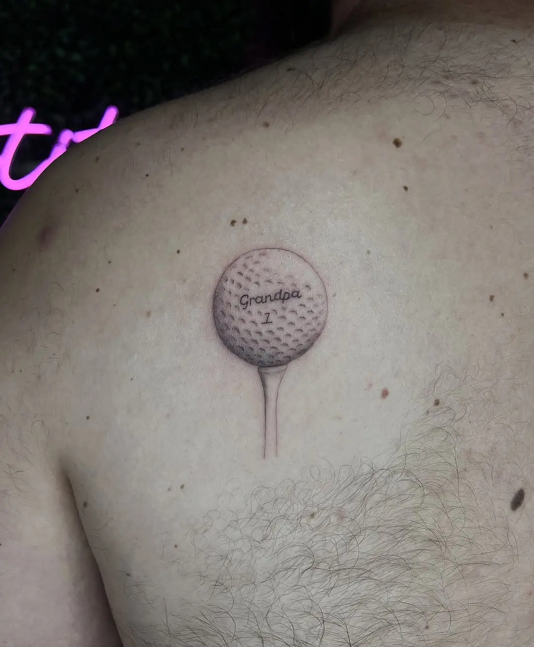 Golf tattoo honoring a beloved grandparent
