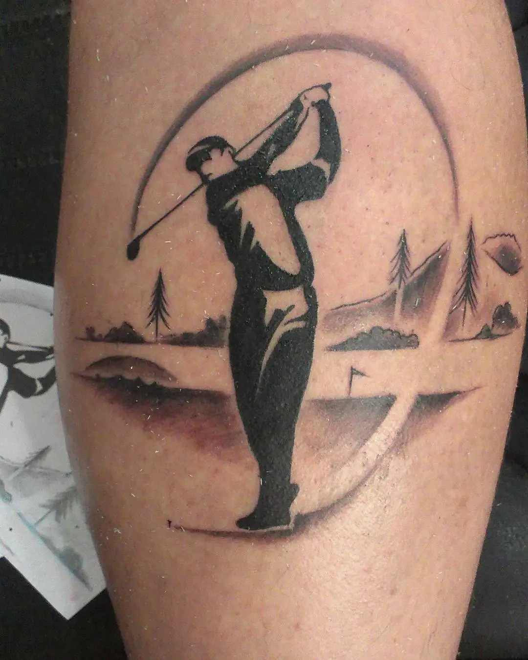 Stylish golfer tattoo encapsulating the swing