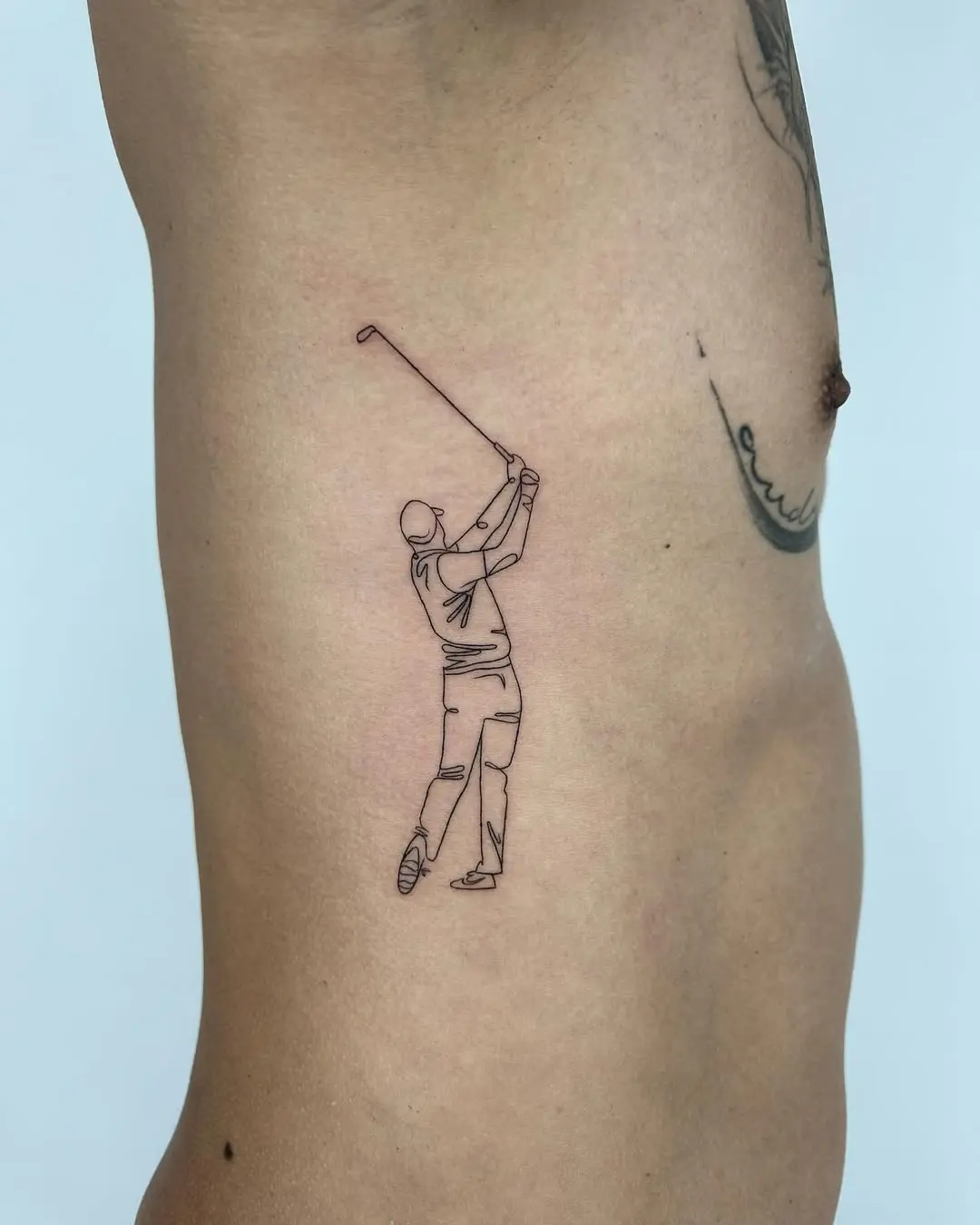 Elegant golf swing tattoo design on skin