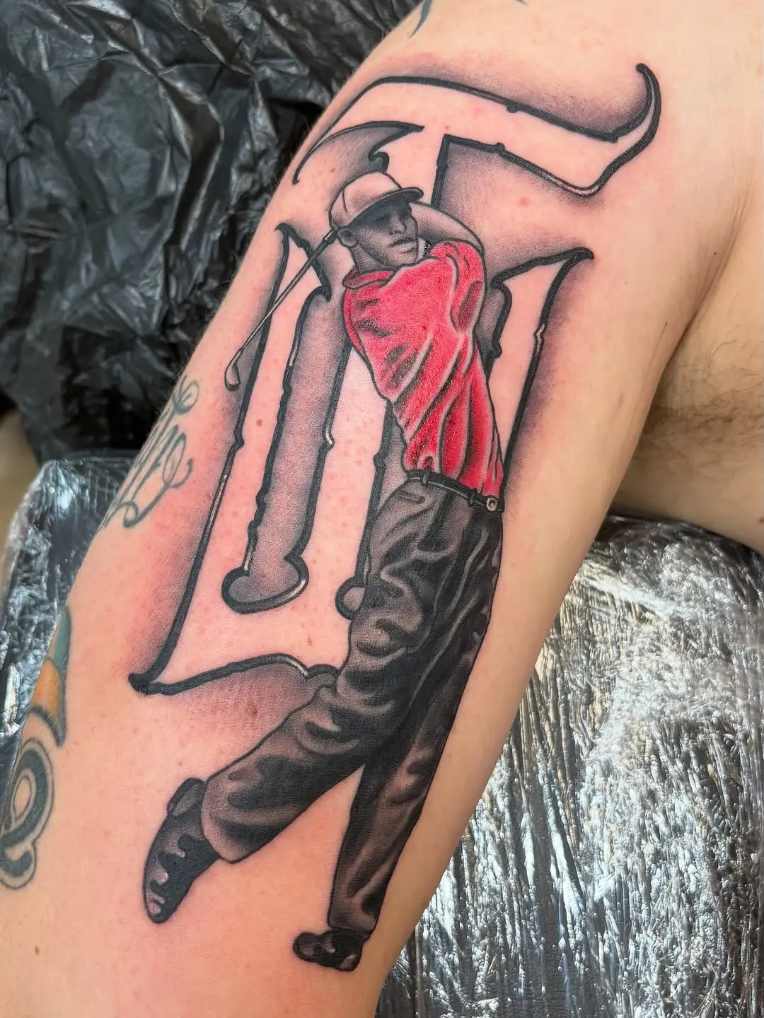 Dynamic golf tattoo capturing a perfect swing