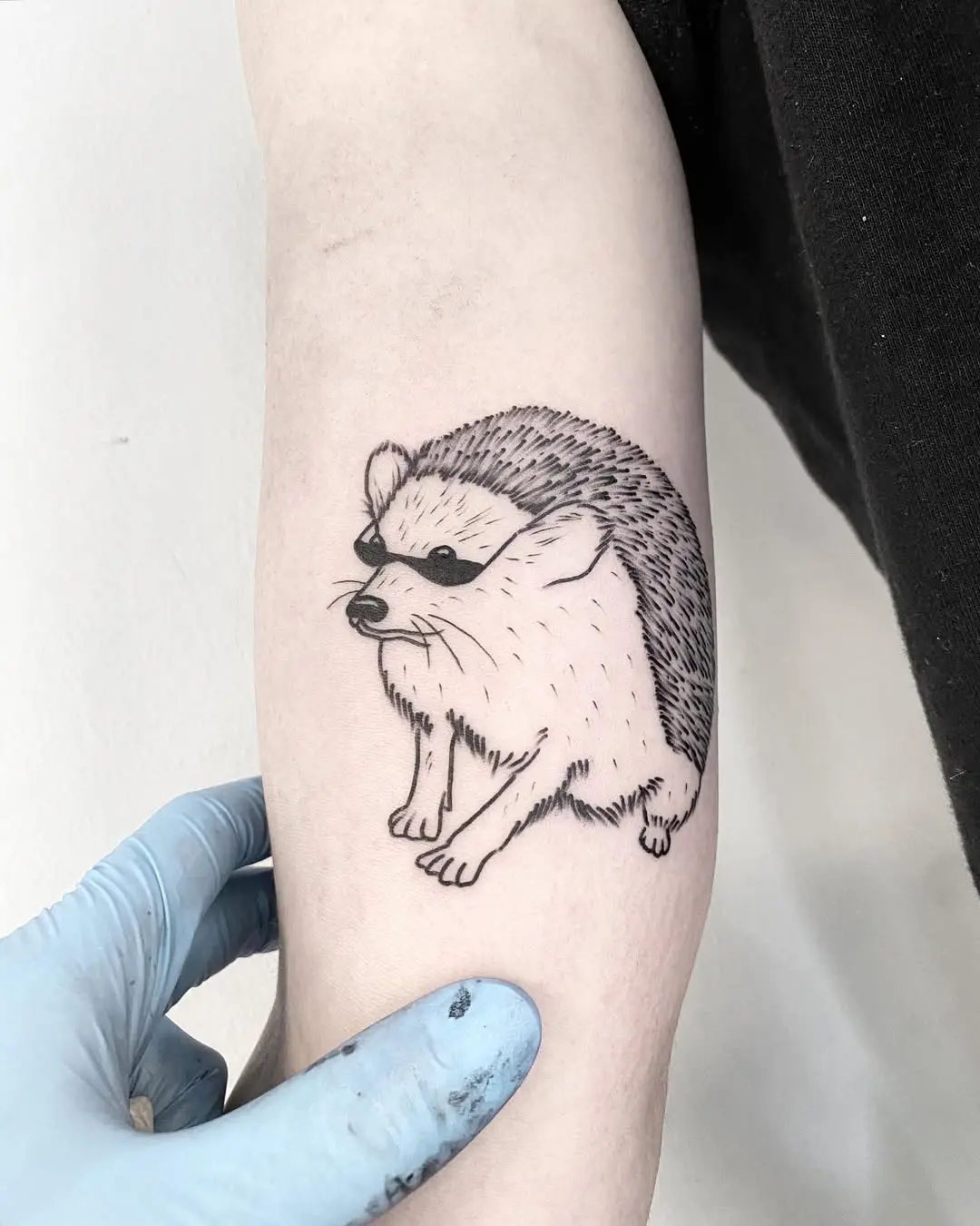 Charming hedgehog tattoo with cute design elements
