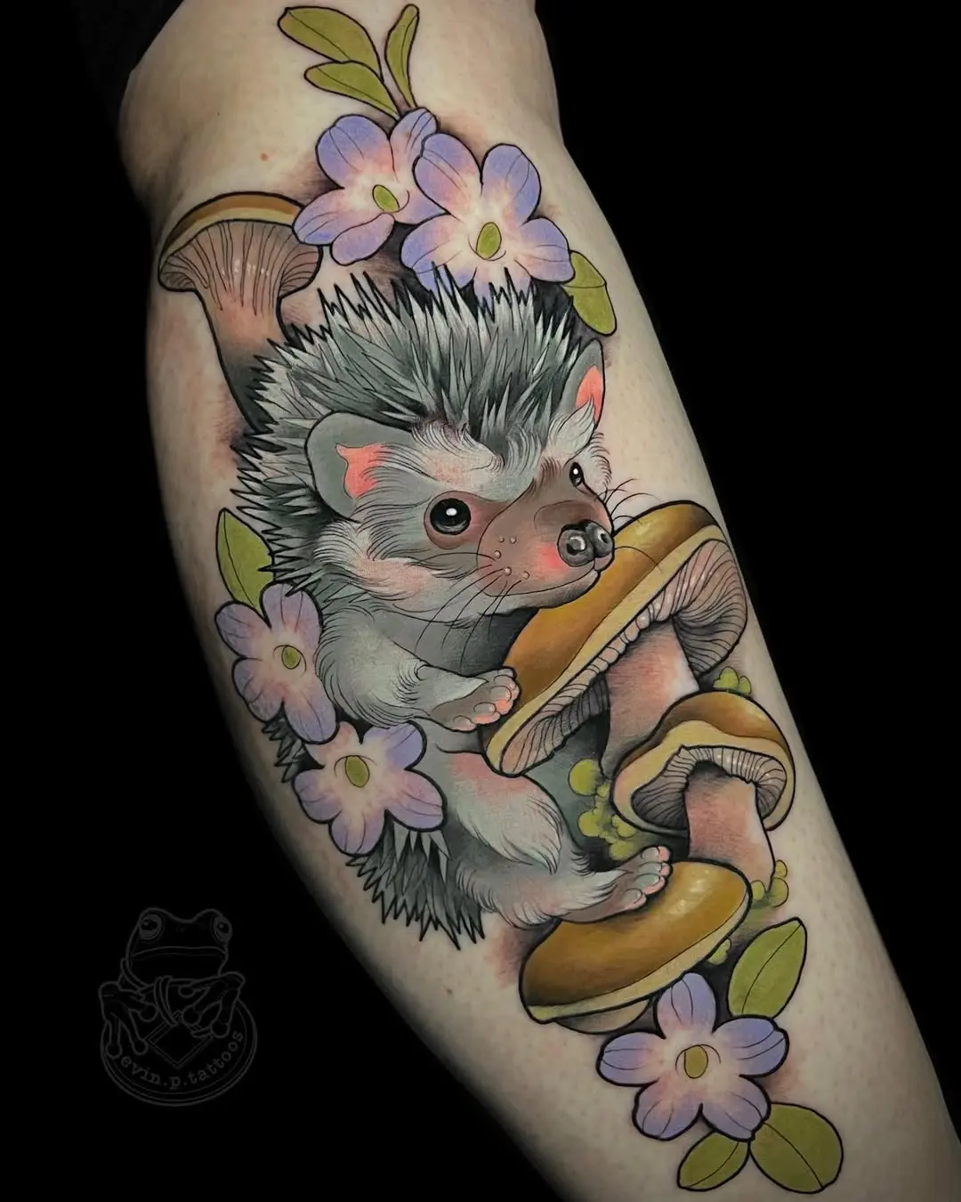 Whimsical hedgehog tattoo with flowers and mushrooms