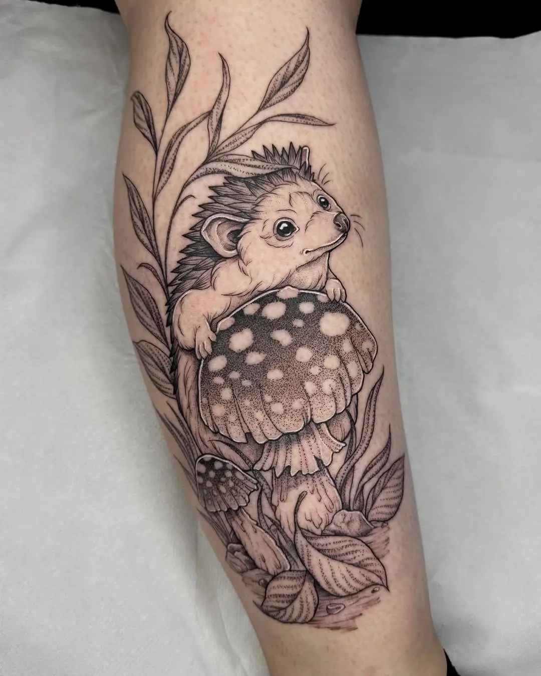 Charming hedgehog tattoo with a mushroom theme